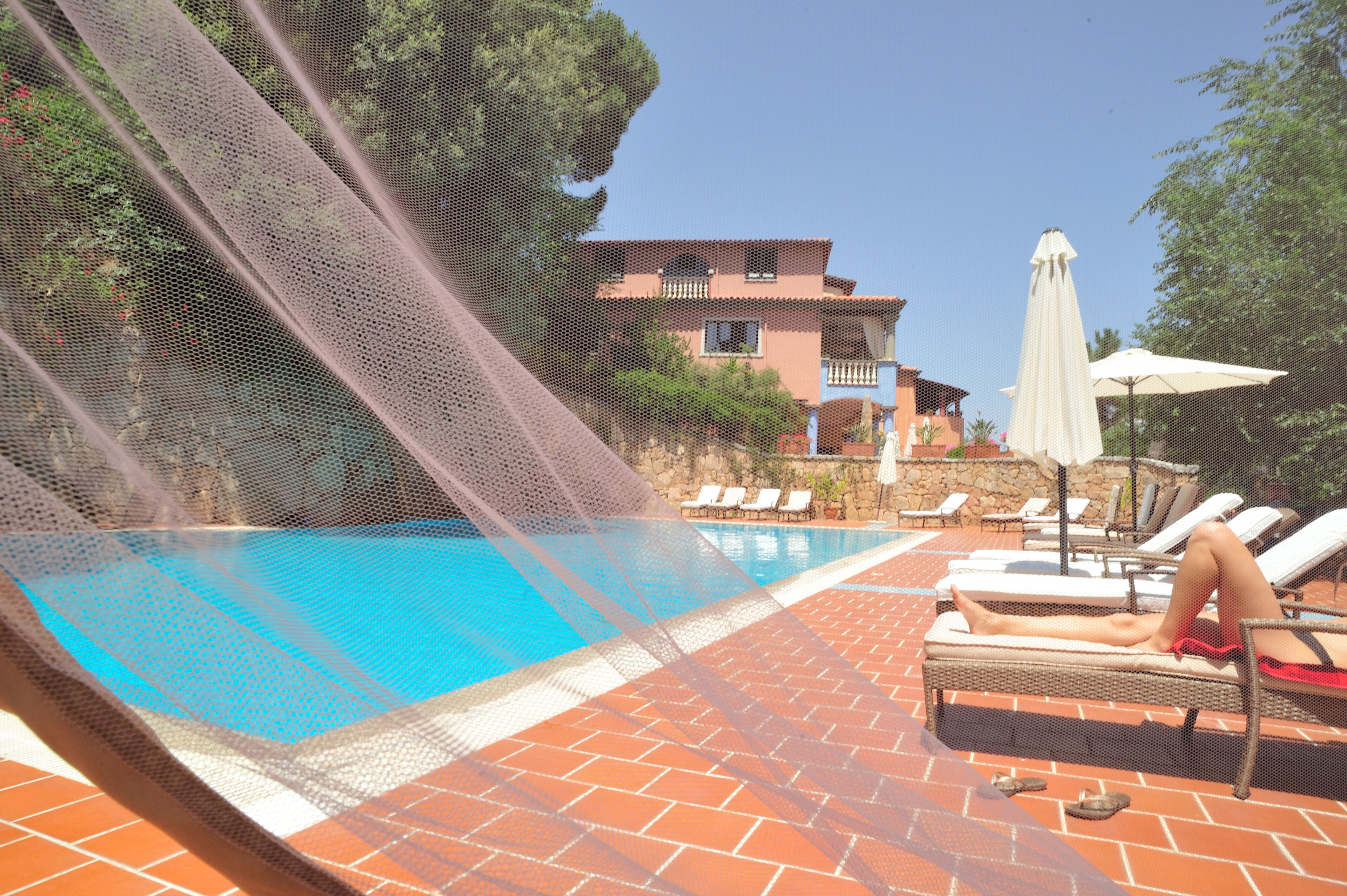 seasonal outdoor pool, open 10:00 am to 7:00 pm, pool umbrellas