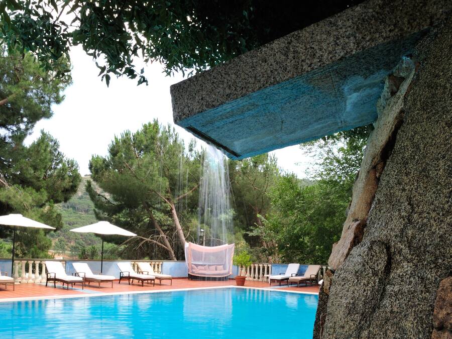 Seasonal outdoor pool, open 10:00 AM to 7:00 PM, pool umbrellas