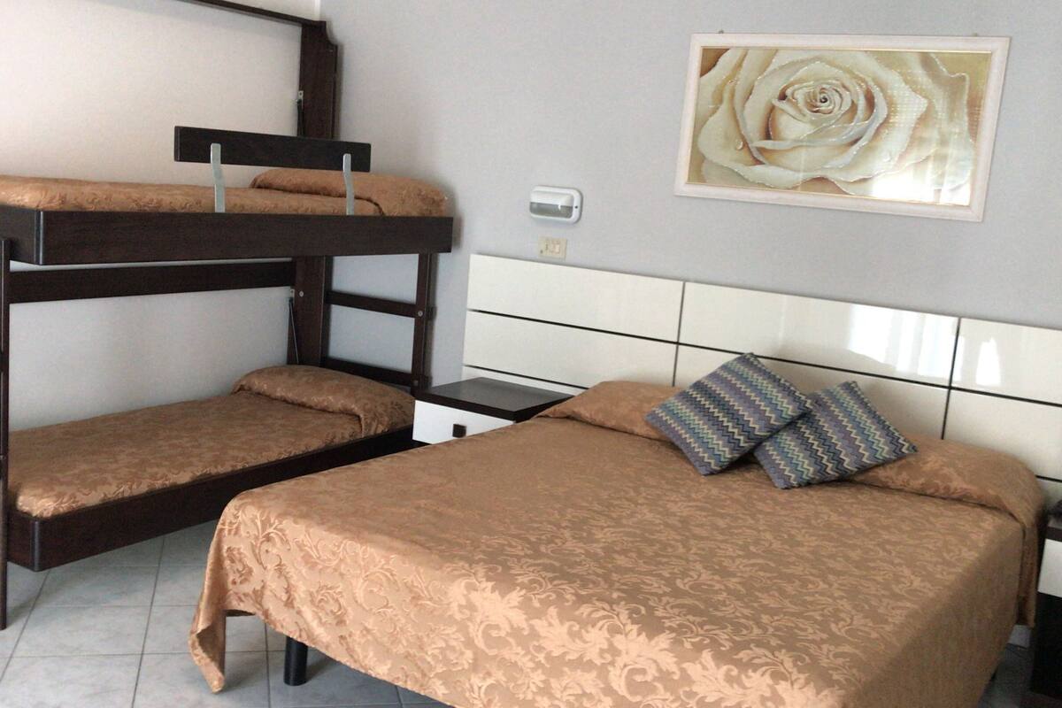 quadruple room | in-room safe, desk, cots/infant beds, rollaway beds