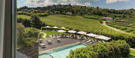 Outdoor pool, open 9:00 AM to 7:30 PM, pool umbrellas, pool loungers