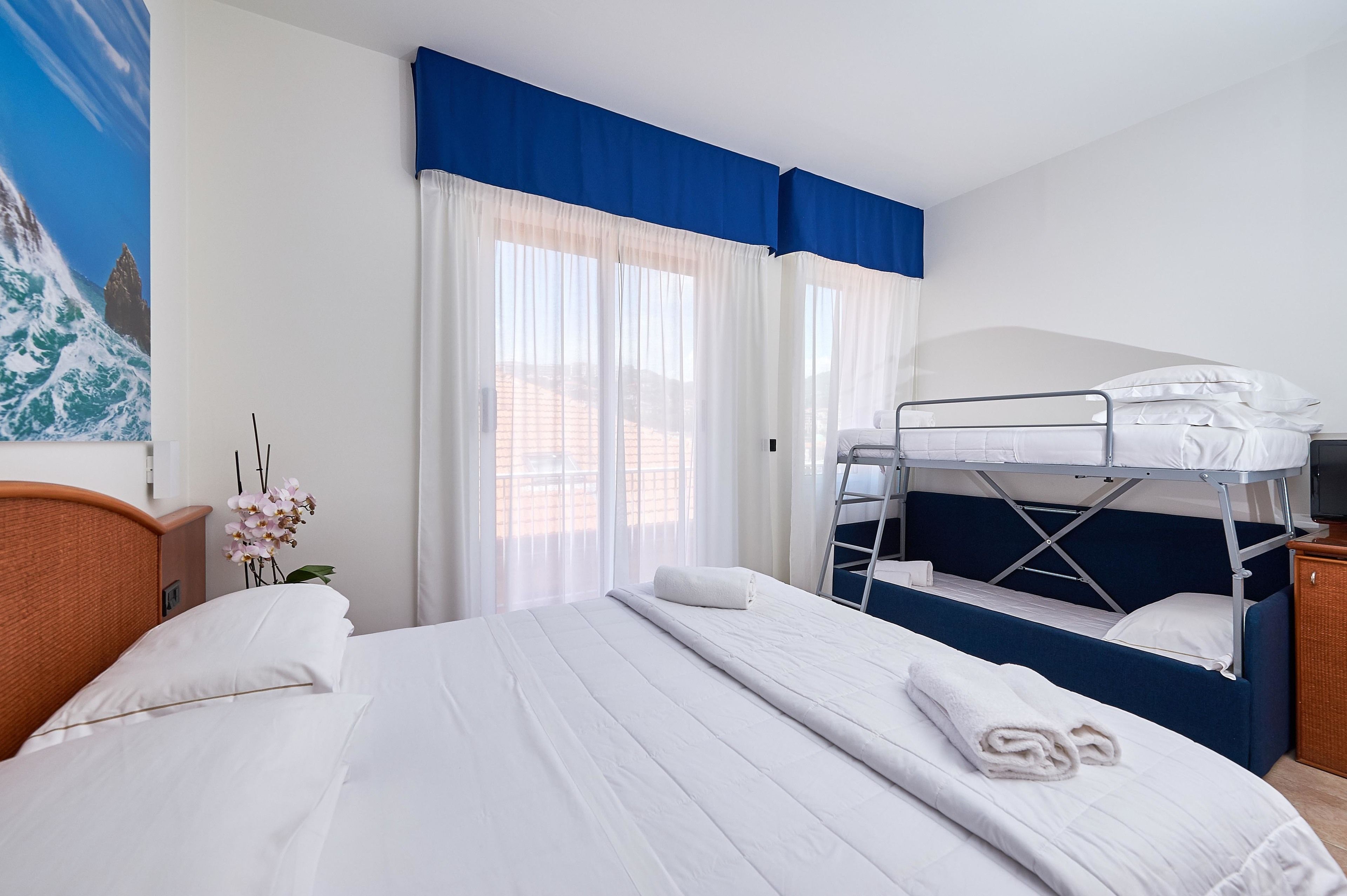 quadruple room | minibar, in-room safe, desk, laptop workspace