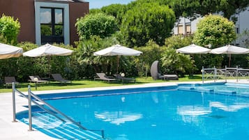 Seasonal outdoor pool, pool umbrellas, pool loungers