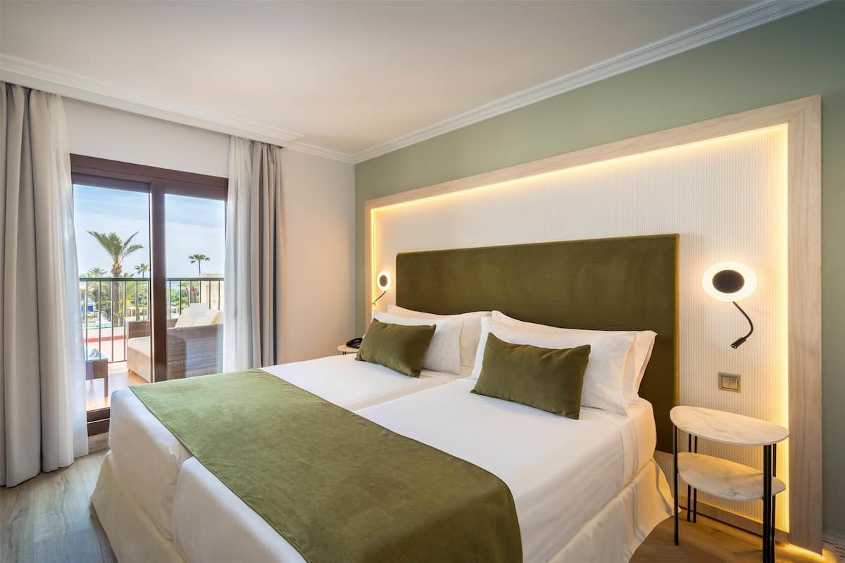 Premium bedding, pillowtop beds, minibar, in-room safe