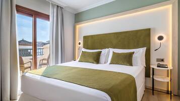 Ropa de cama de alta calidad, colchones con acolchado adicional, minibar