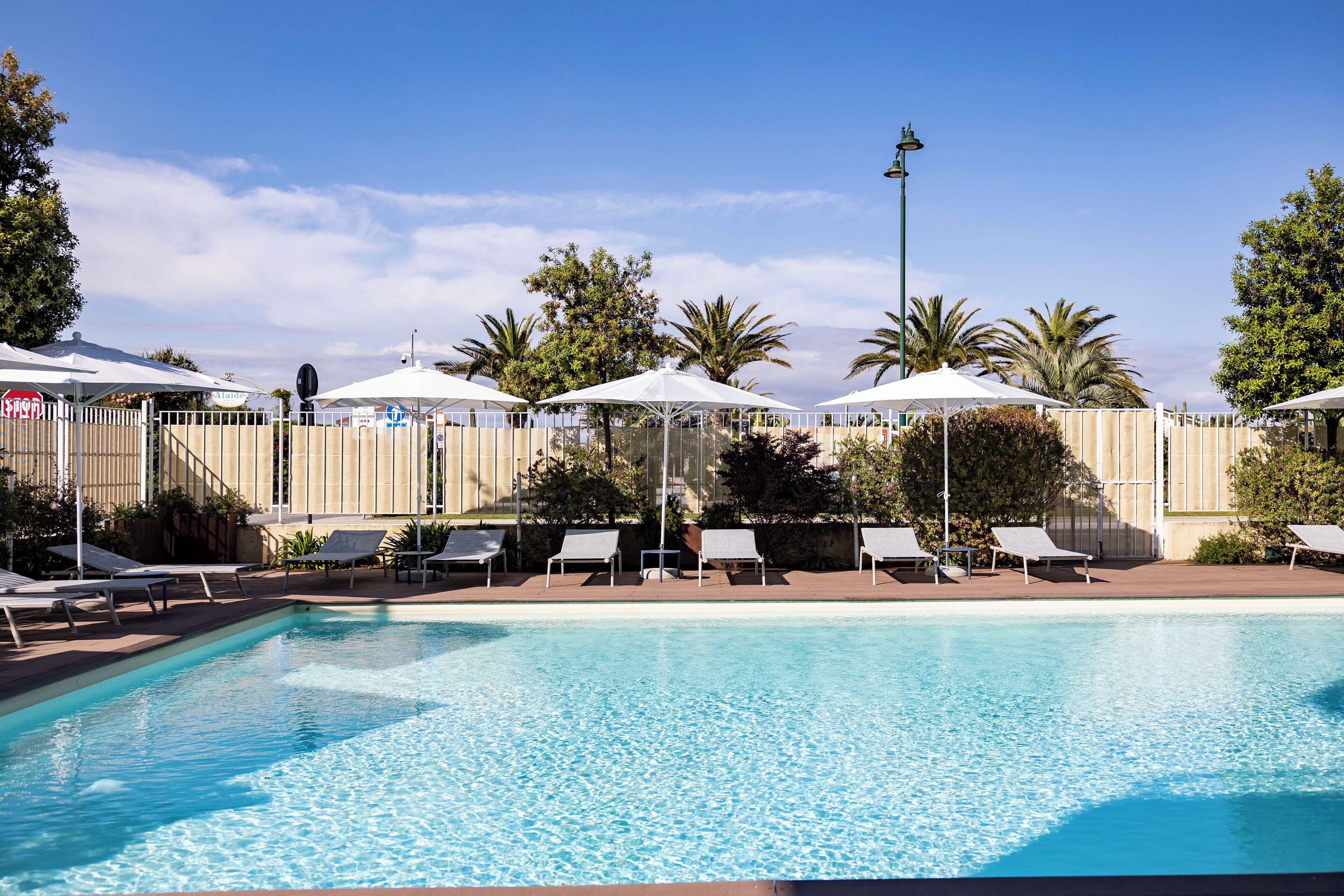 outdoor pool, pool umbrellas, pool loungers