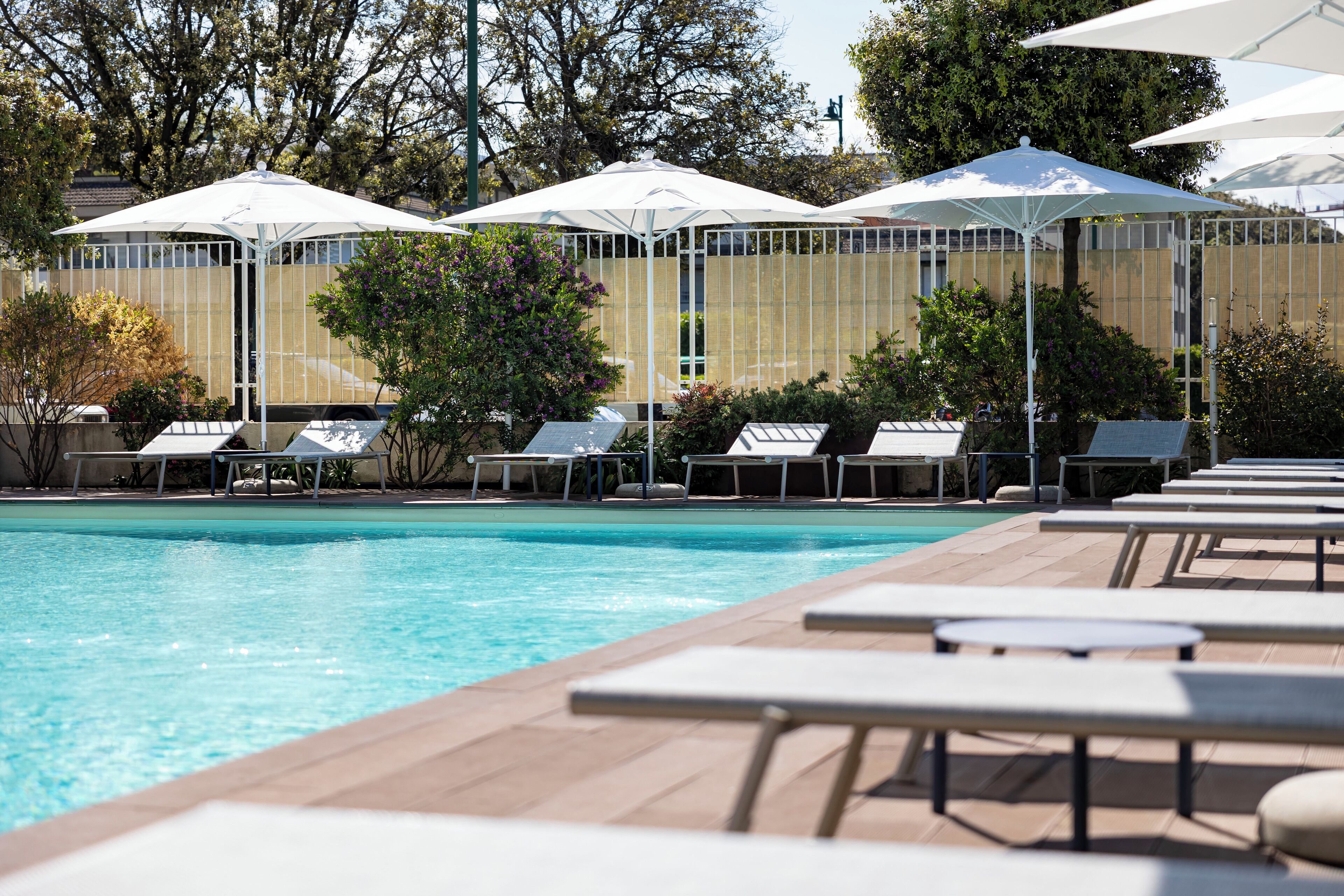 outdoor pool, pool umbrellas, pool loungers