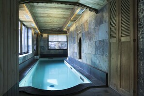 Indoor pool, open 10:30 AM to 7:00 PM, pool loungers