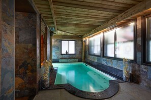 Indoor pool, open 10:30 AM to 7:00 PM, pool loungers