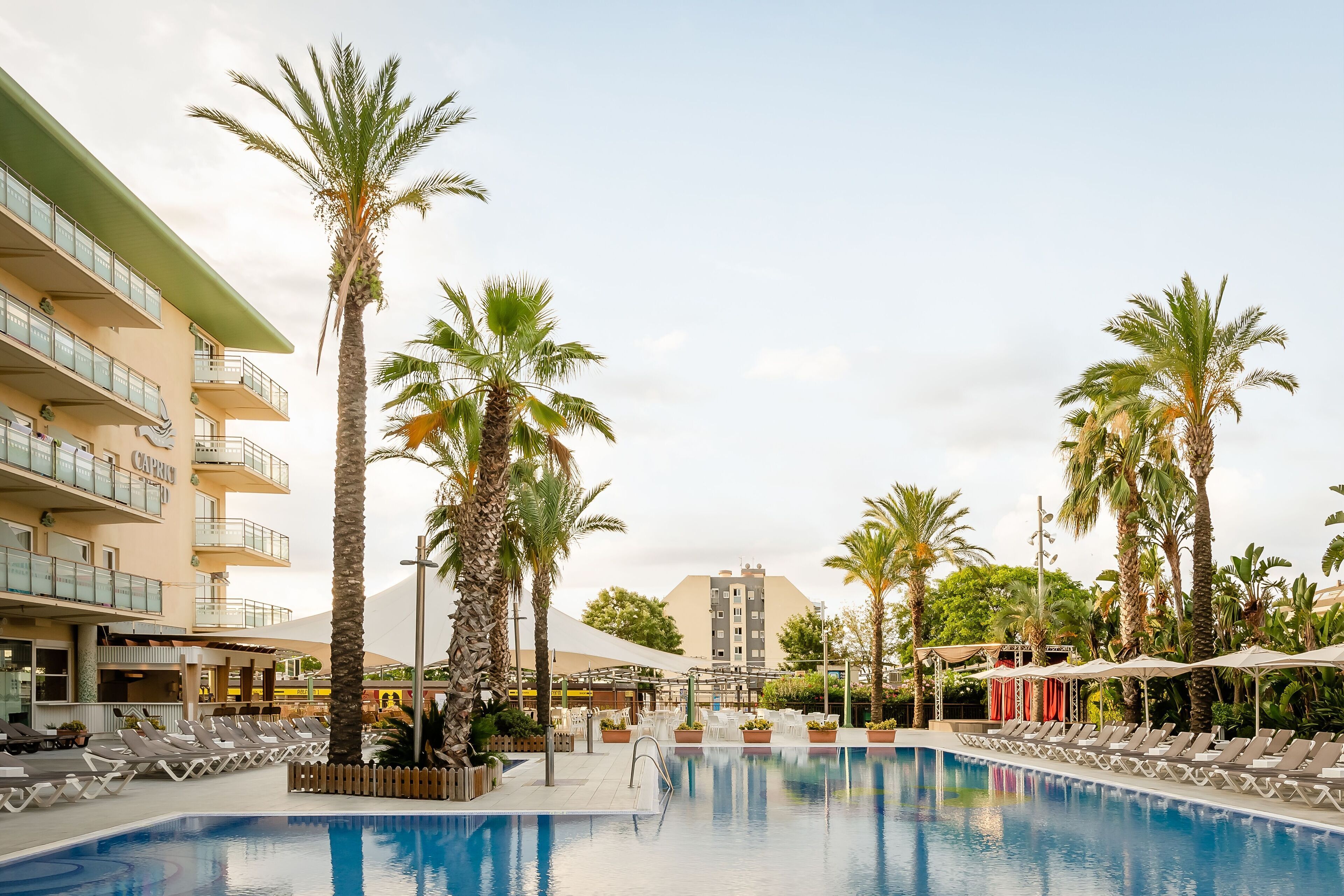 seasonal outdoor pool, pool umbrellas, pool loungers