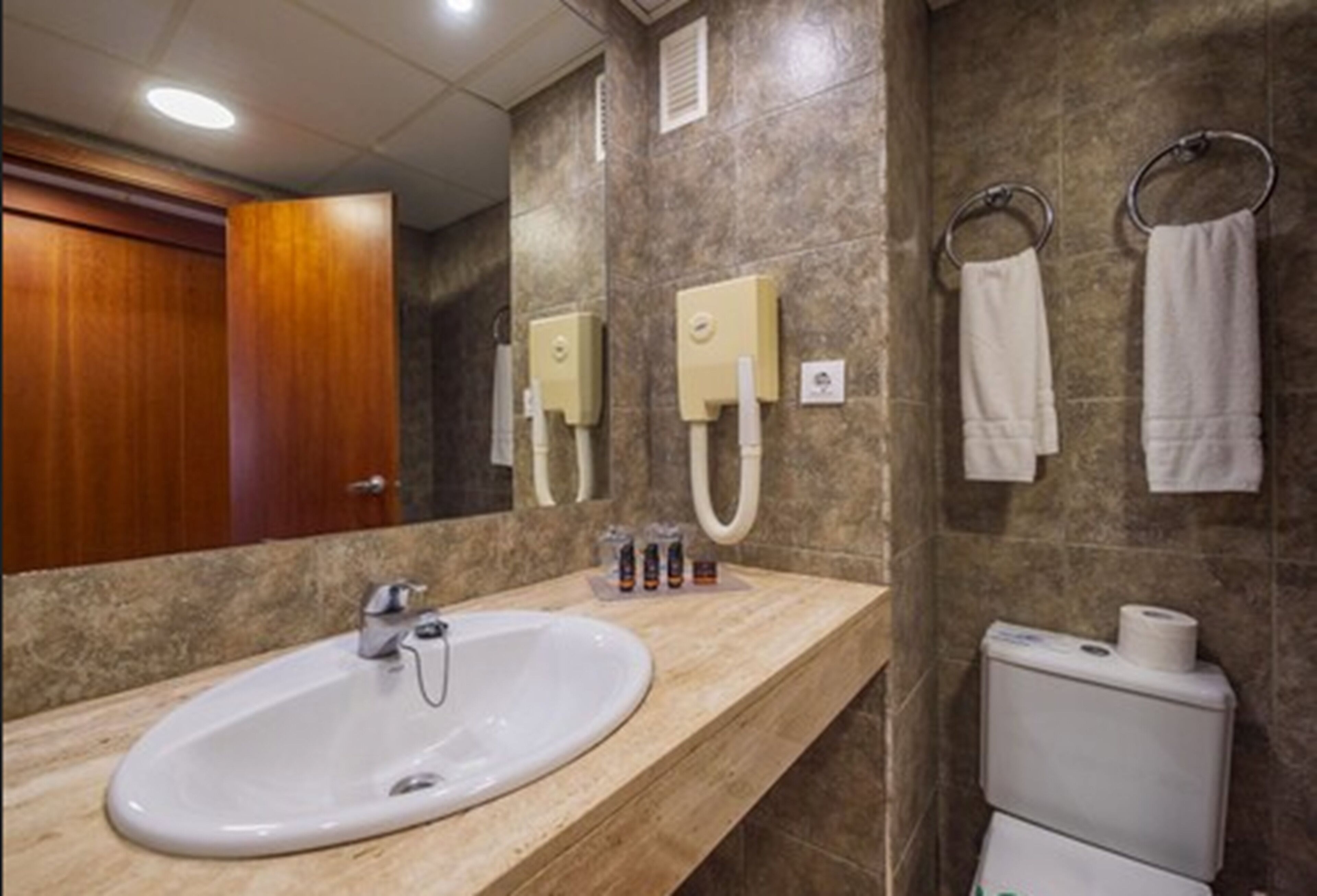 free toiletries, hair dryer, bidet, towels