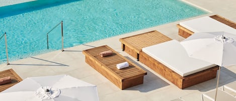 Outdoor pool, open 10:00 AM to 8:00 PM, pool umbrellas, pool loungers
