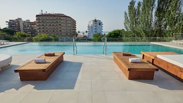 Outdoor pool, open 9:00 AM to 7:00 PM, pool umbrellas, pool loungers