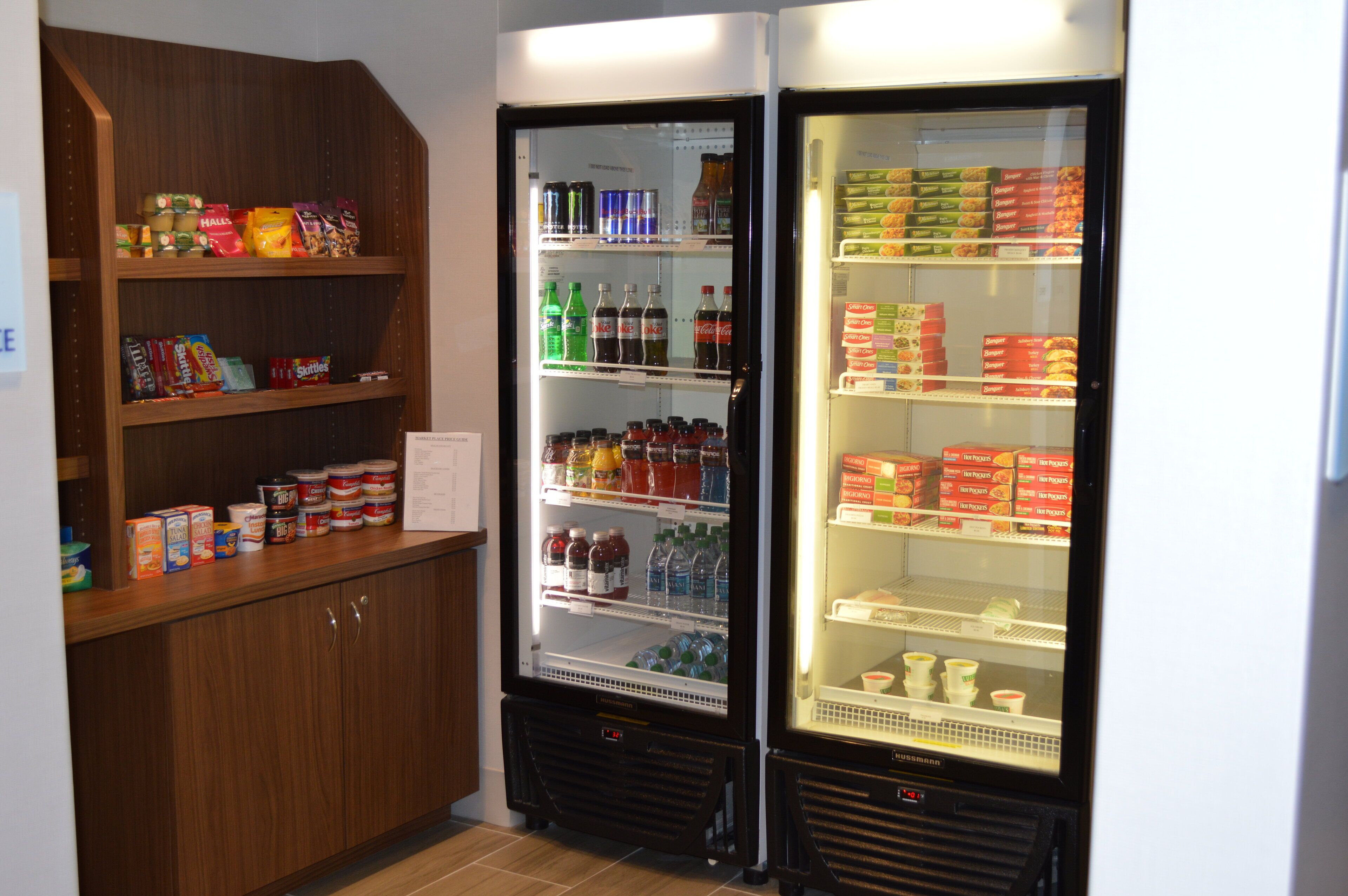 A refrigerated display case with various food items and beverages.
