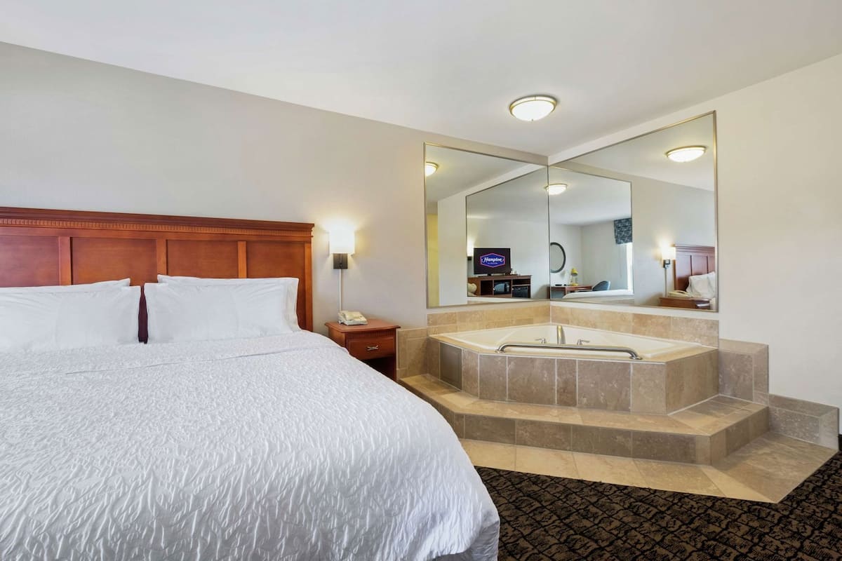 Hypo-allergenic bedding, down duvets, desk, laptop workspace