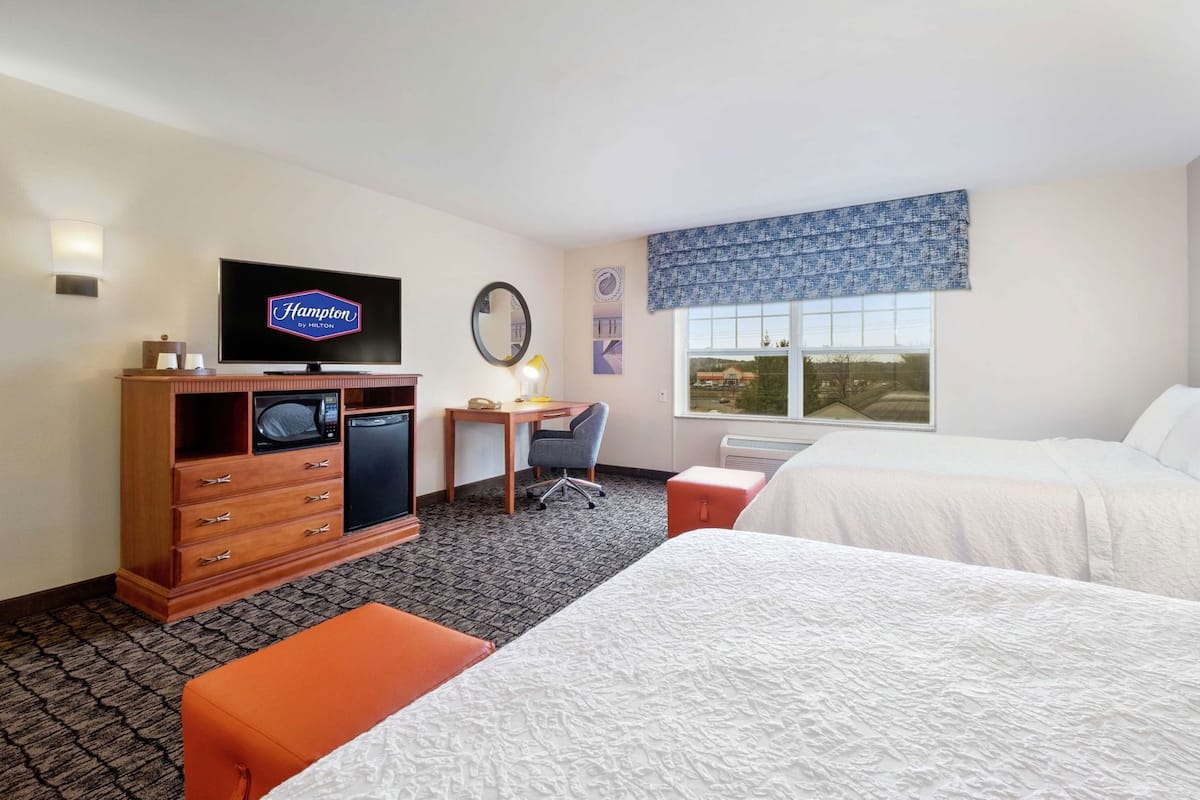 Hypo-allergenic bedding, down duvets, desk, laptop workspace