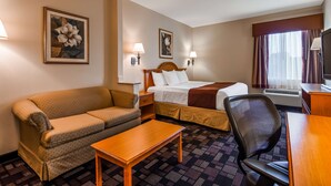 A hotel room with a sofa, a bed, a desk, and a chair. - Best Western Longview (Longview)