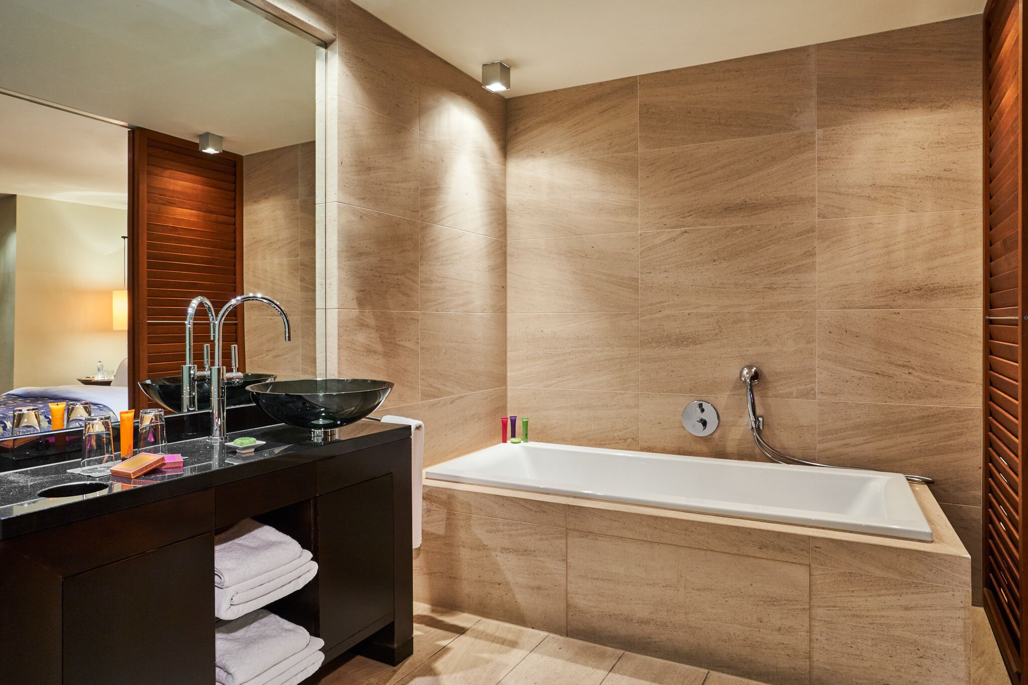 deluxe room, courtyard view | bathroom | rainfall showerhead, designer toiletries, hair dryer, bathrobes