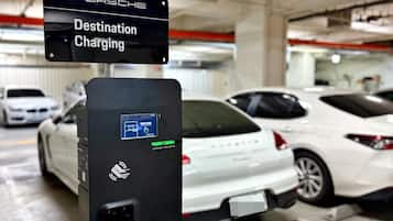 A destination charging station for Porsche cars in a parking garage.