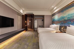 A modern hotel room with a large bed, a TV mounted on the wall, a walk-in closet, and a large abstract painting. - Miramar Garden Taipei (Taipei)