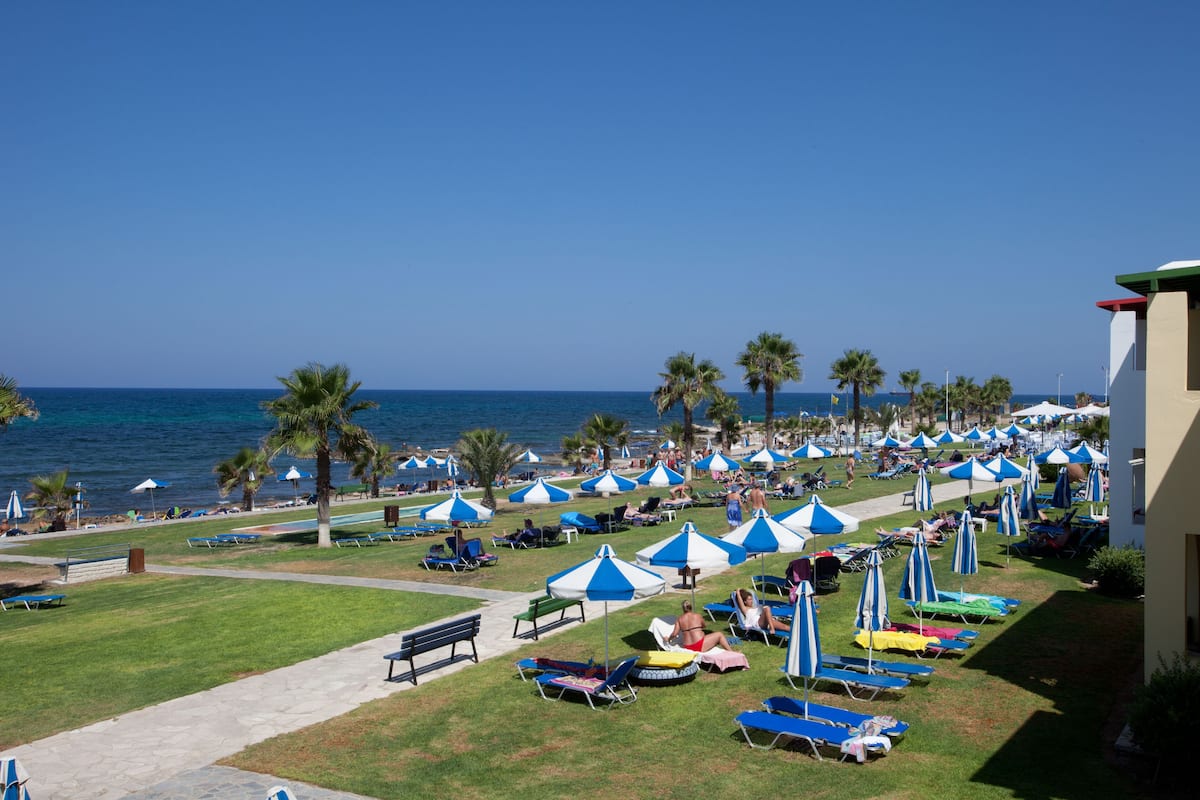 on the beach, sun-loungers, beach umbrellas, beach towels