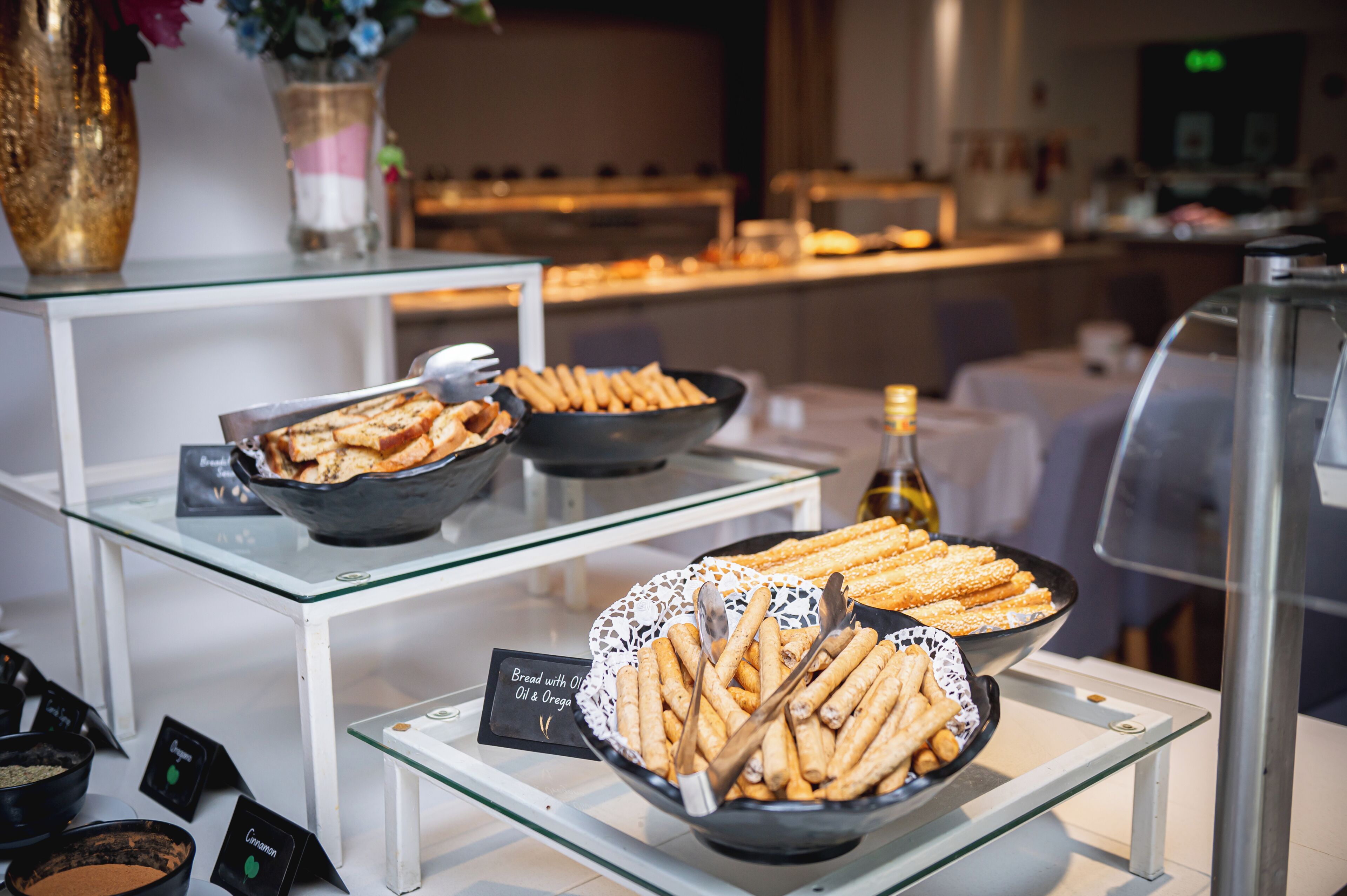 A buffet with bread and pastries.