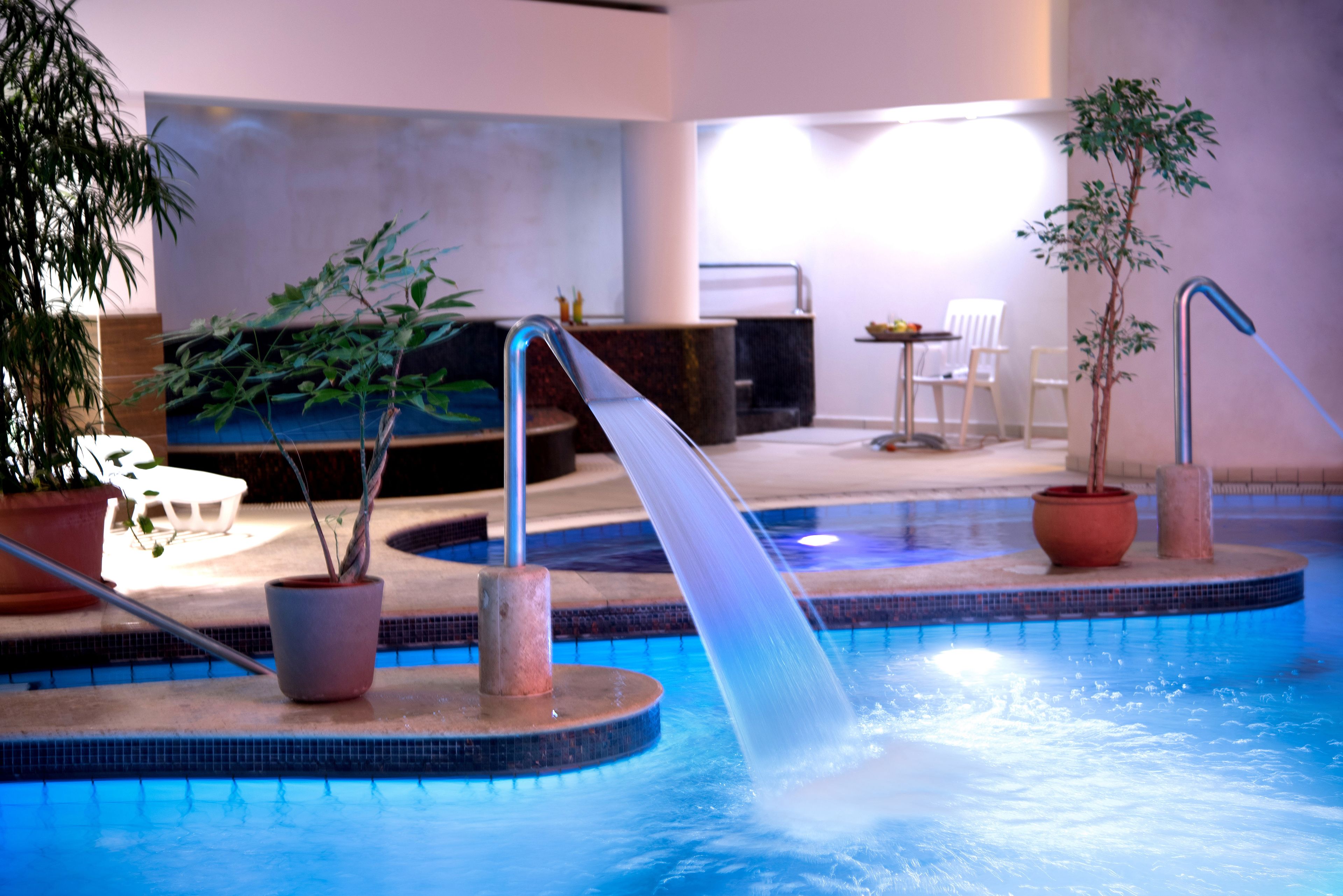 indoor pool, pool loungers, lifeguards on site