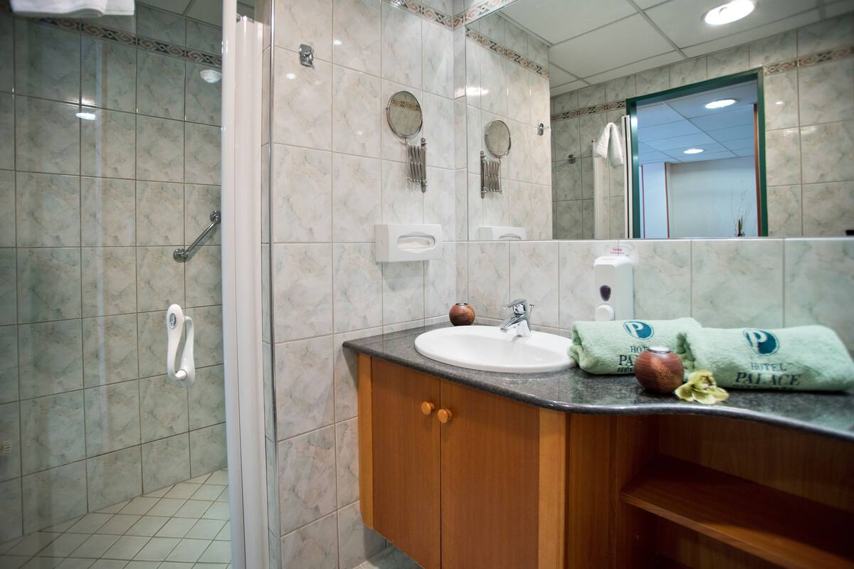 shower, hair dryer, bathrobes, towels