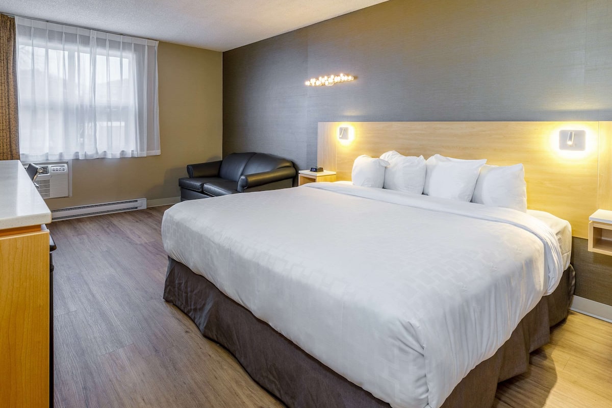 desk, laptop workspace, blackout curtains, iron/ironing board