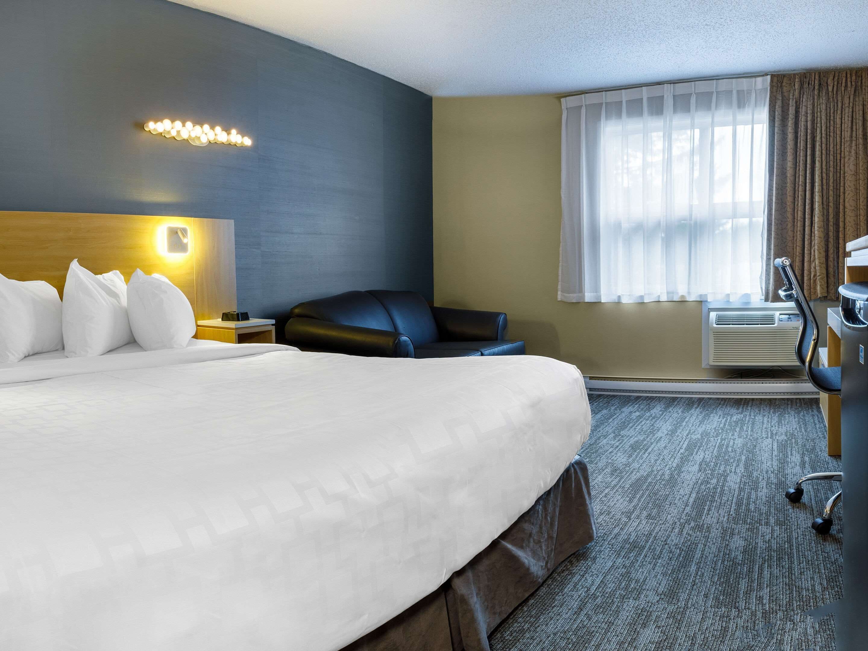 desk, laptop workspace, blackout curtains, iron/ironing board