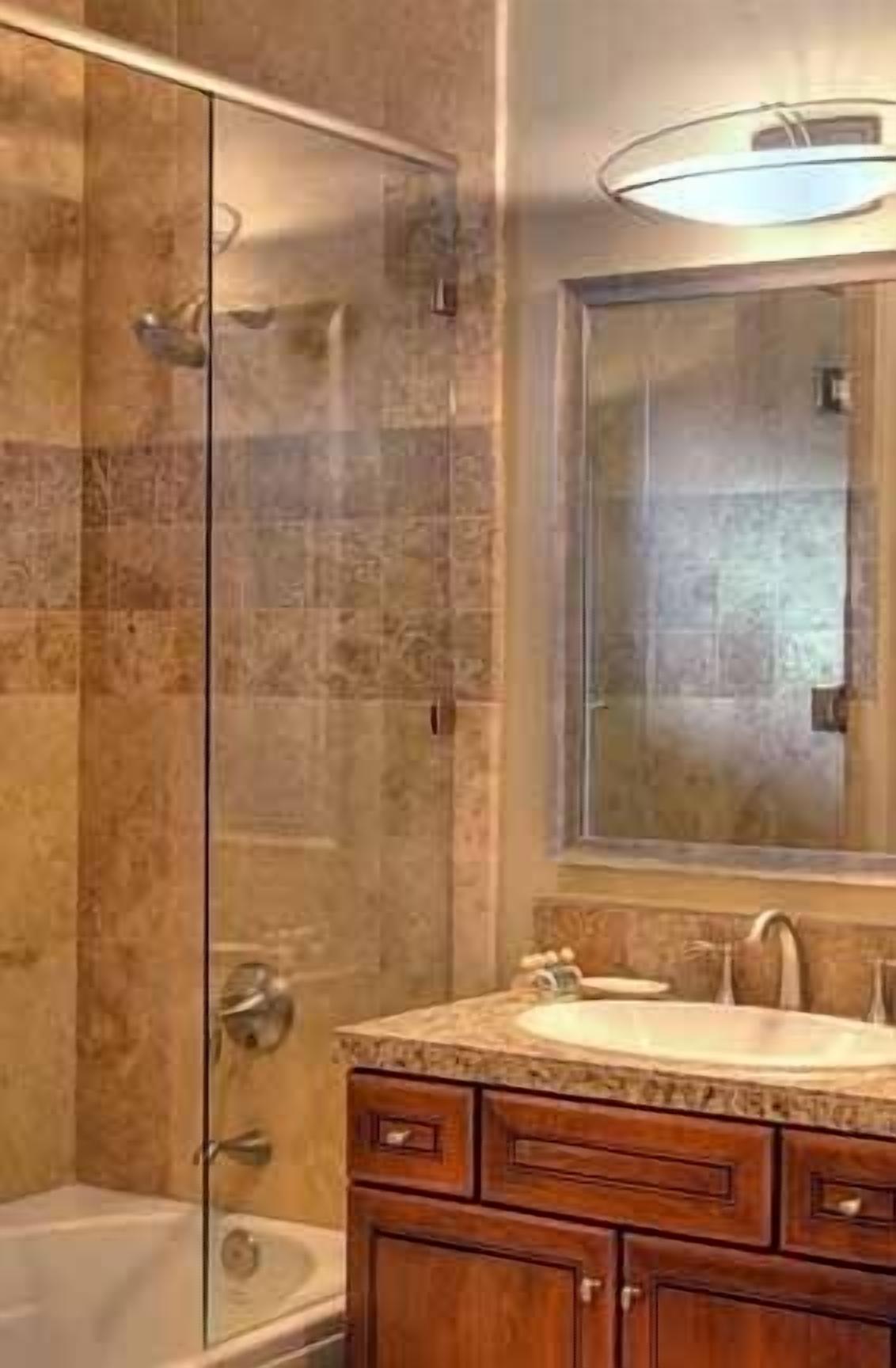 condo, 2 bedrooms | bathroom | combined shower/bathtub, free toiletries, hair dryer, towels