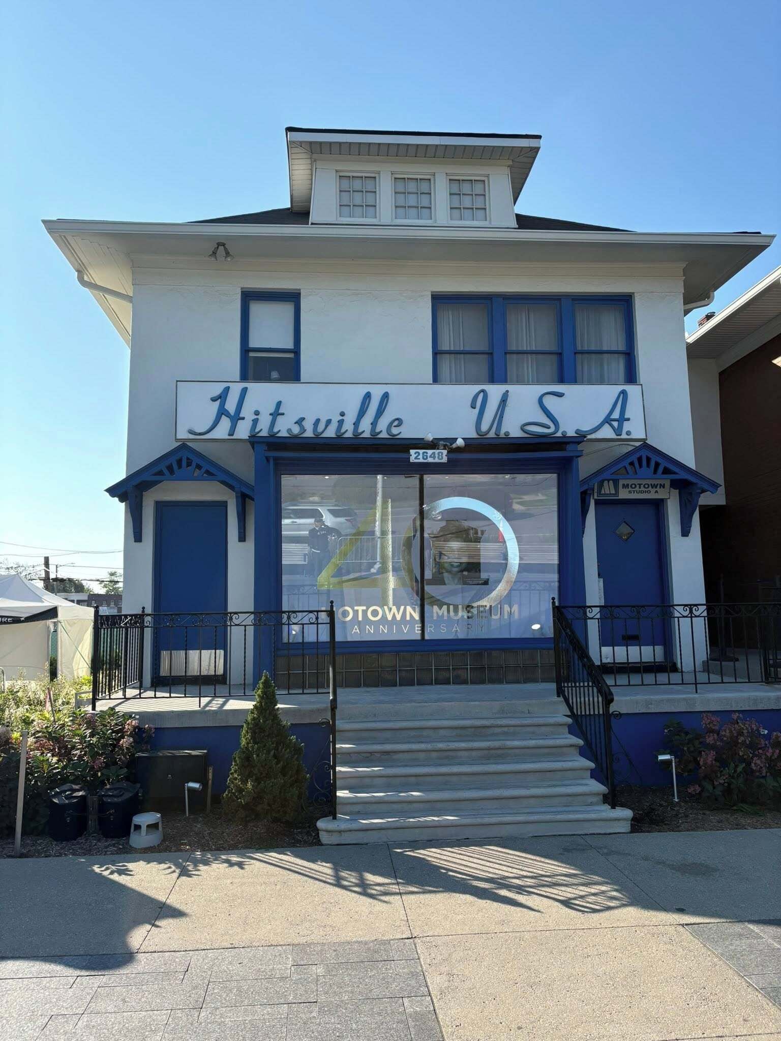 A building with a sign reading 'Hitsville USA' and 'OTOWN MUSEUM ANNIVERSARY'.