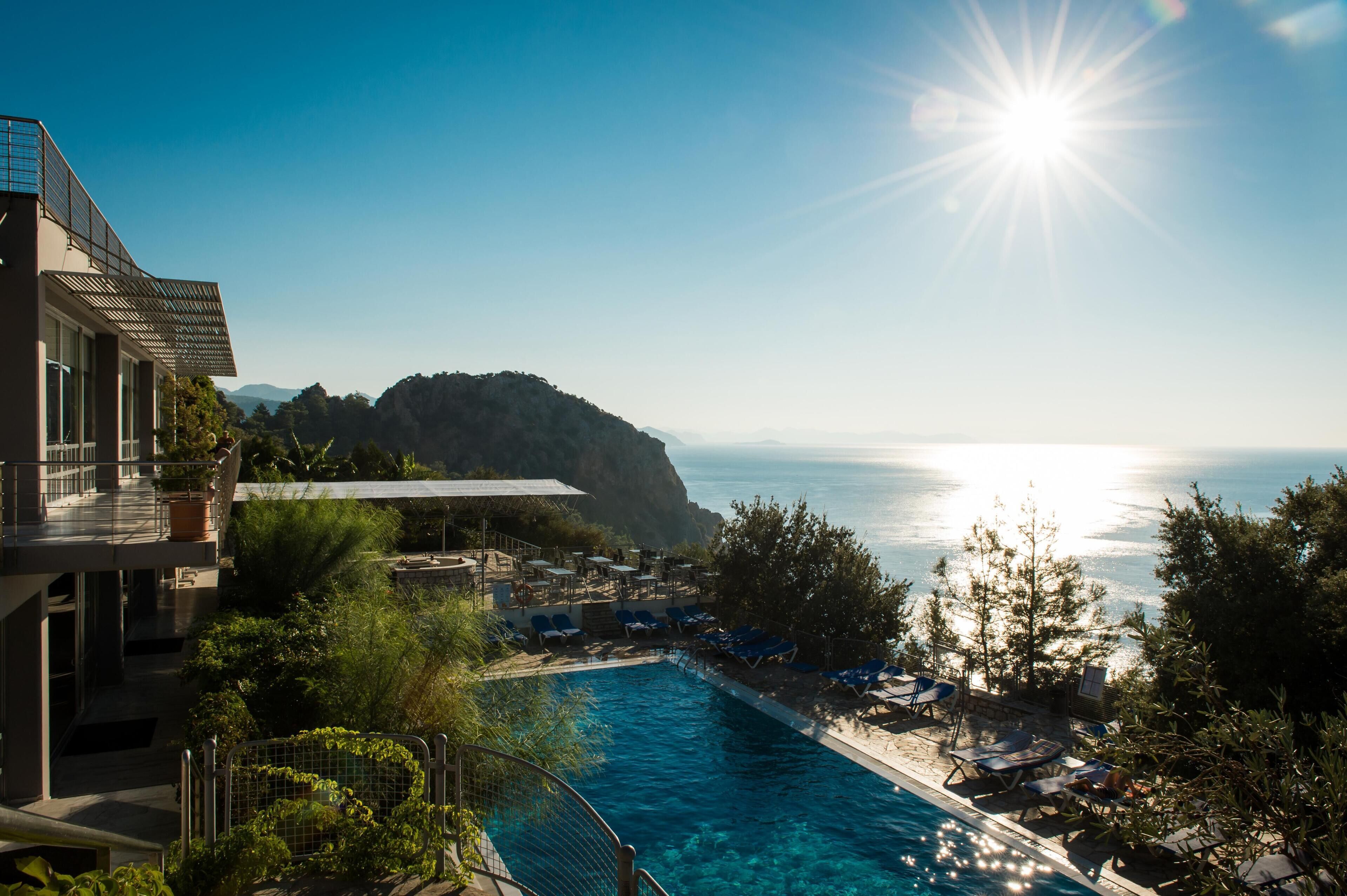 Indoor pool, seasonal outdoor pool, pool umbrellas, pool loungers