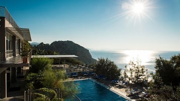 Indoor pool, seasonal outdoor pool, pool umbrellas, pool loungers