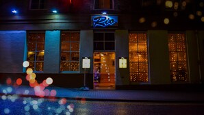 A building with a neon sign reading "Rio" and a visible entrance. - The Argyll Hotel (Dunoon)