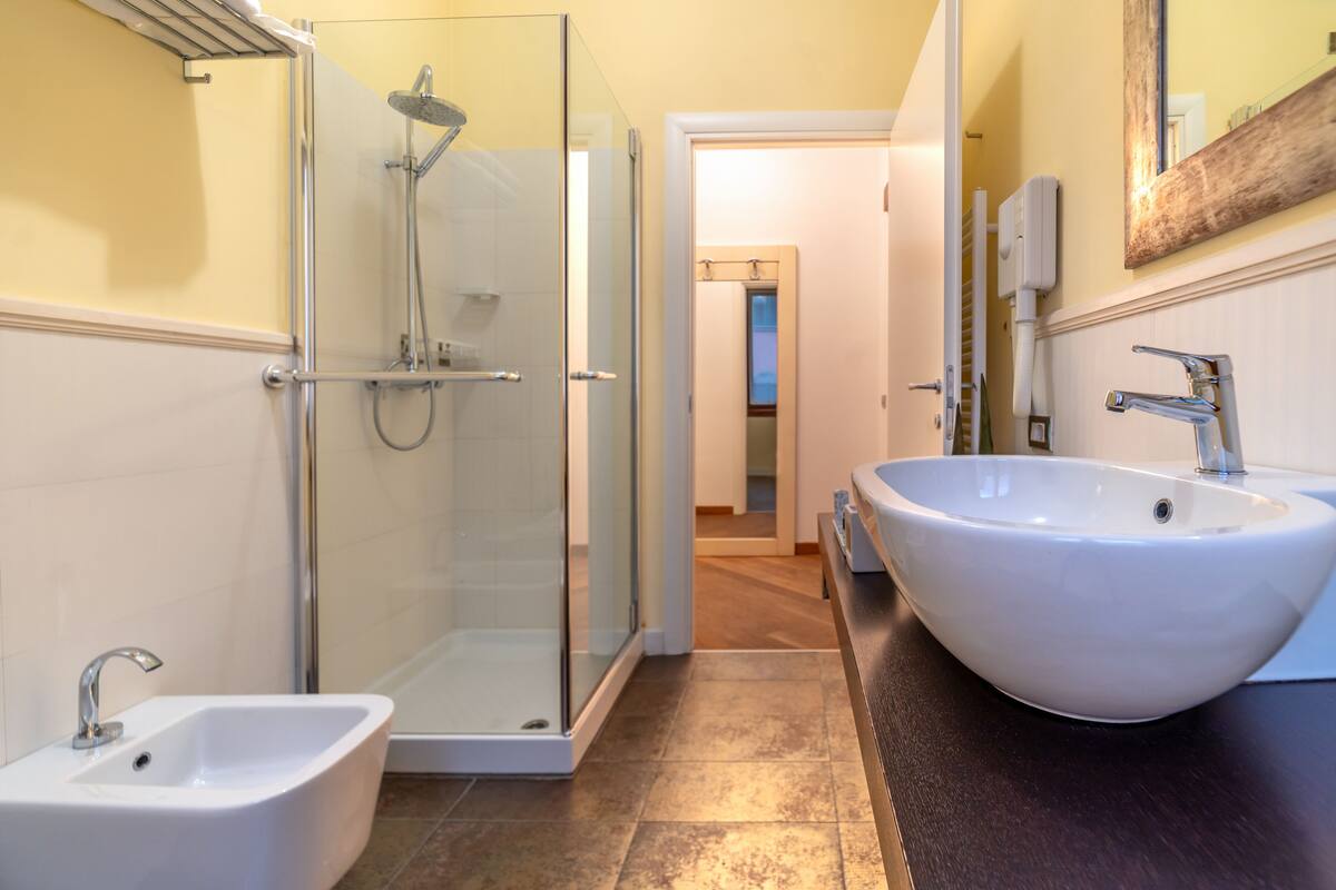 superior triple room | bathroom | shower, free toiletries, hair dryer, towels