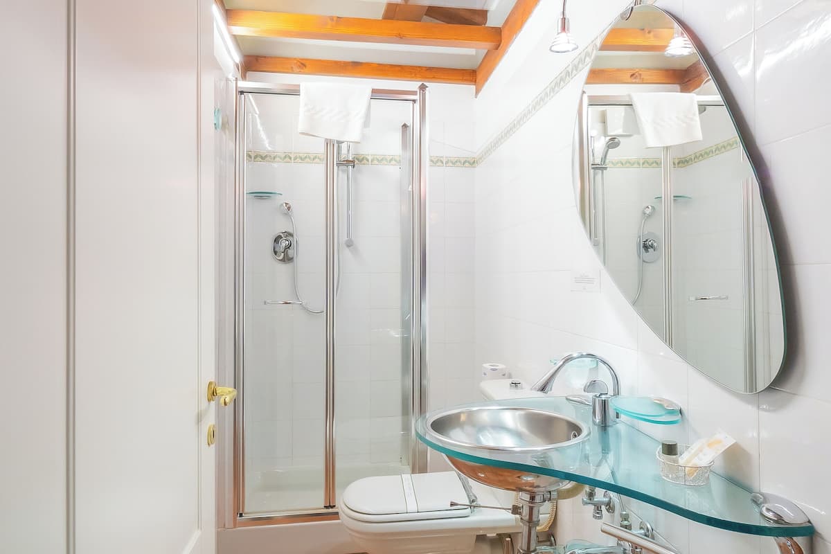 economy room, city view | bathroom | shower, free toiletries, hair dryer, towels