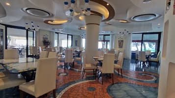 Breakfast, lunch, dinner served; local cuisine, alfresco dining