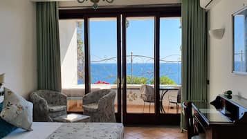 Deluxe Room, 1 Bedroom, Sea View | Minibar, in-room safe, desk, blackout drapes