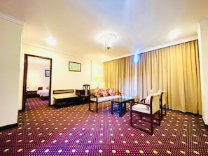 Premium Suite, 1 Double Bed | Minibar, desk, blackout drapes, soundproofing - Saigontourane Hotel (Da Nang)