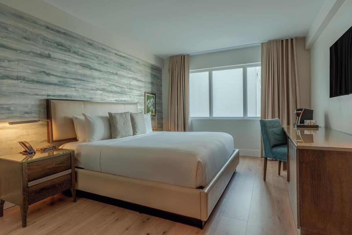 Premium bedding, down comforters, in-room safe, desk