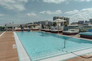 Outdoor pool, open 8:00 AM to 8:00 PM, pool umbrellas, sun loungers