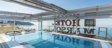 Seasonal outdoor pool, open 9:00 AM to 9:00 PM, pool loungers