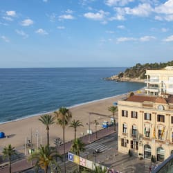 On the beach, sun-loungers, beach umbrellas, beach towels