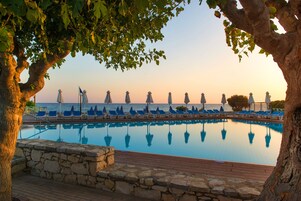 Seasonal outdoor pool, pool umbrellas, pool loungers