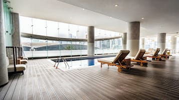 Indoor pool, open 7:00 AM to 10:00 PM, pool loungers