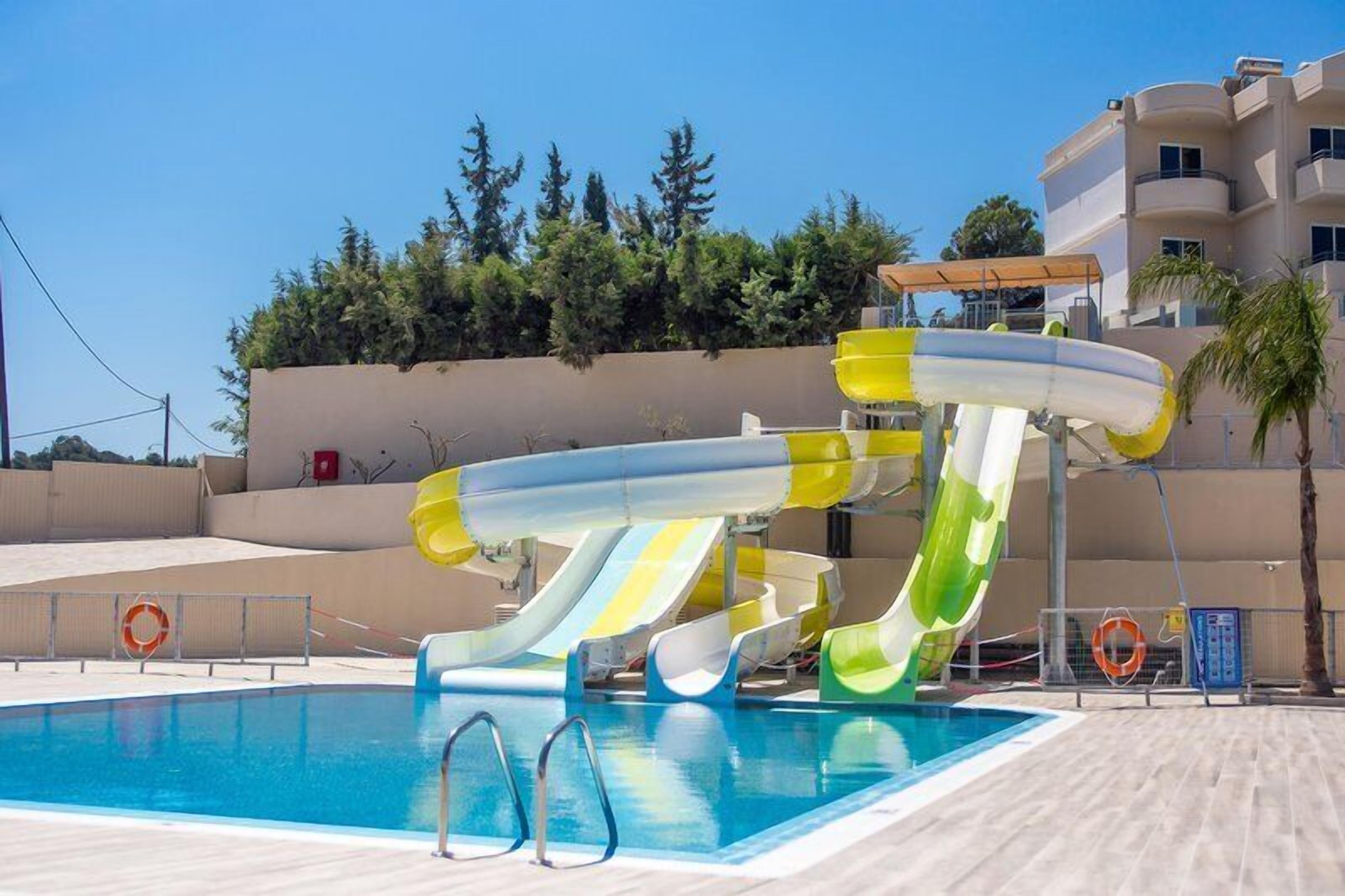 Seasonal outdoor pool, open 10:00 AM to 7:00 PM, pool umbrellas