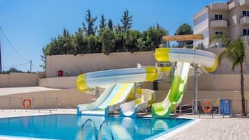 Seasonal outdoor pool, open 10:00 AM to 7:00 PM, pool umbrellas