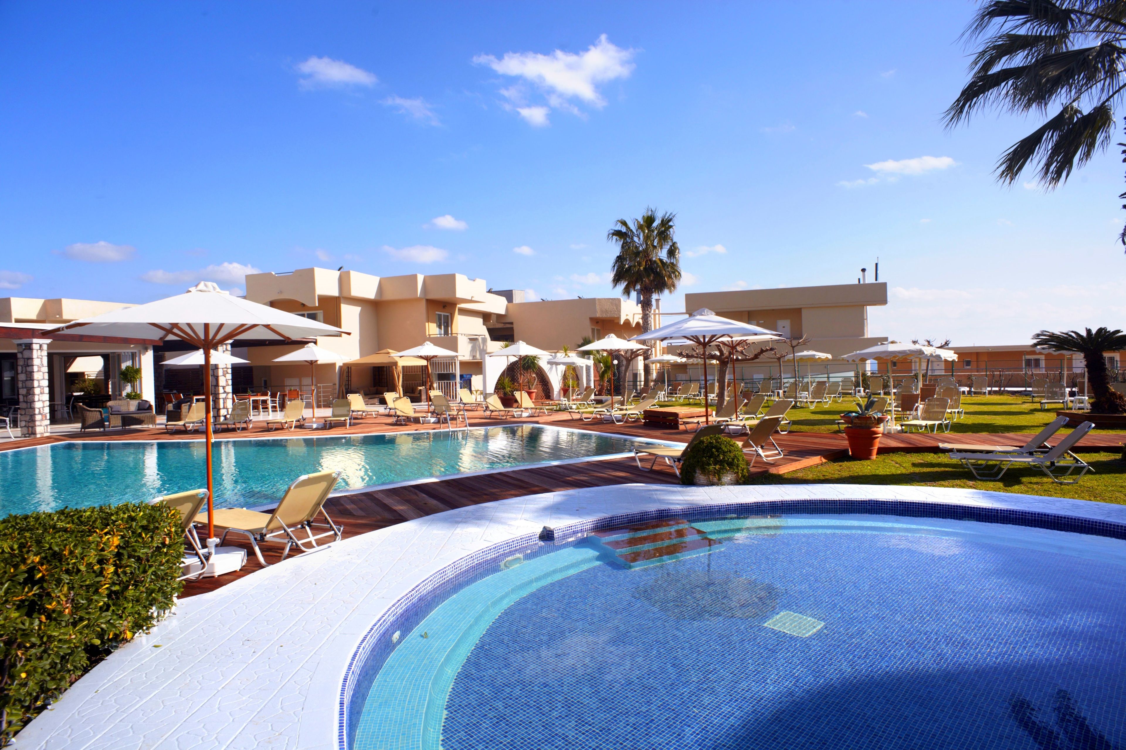 Seasonal outdoor pool, open 10:00 AM to 7:00 PM, pool umbrellas