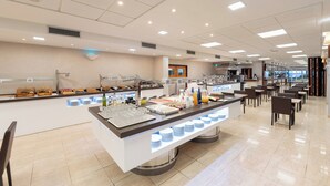 A buffet area with multiple food stations and seating arrangements. - Hotel RH Riviera -  Recommended for Adults By Hoteles RH (Gandia)