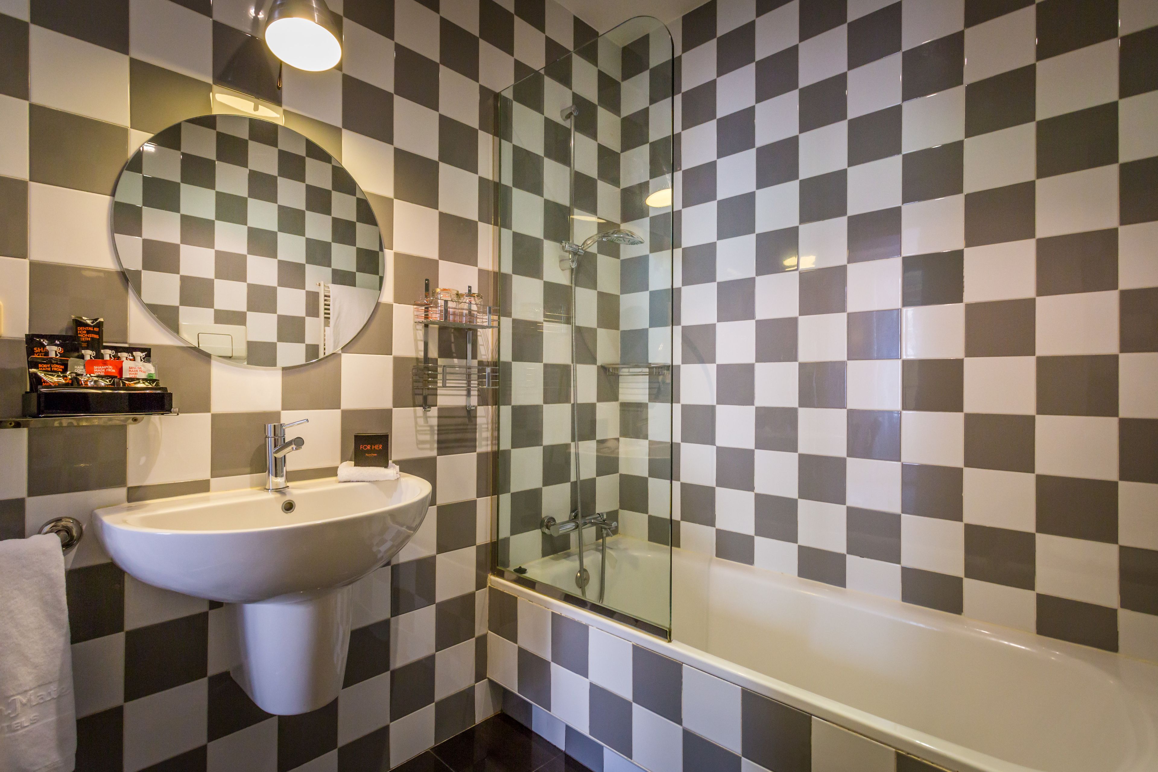 junior suite, 1 king bed | bathroom | eco-friendly toiletries, hair dryer, towels